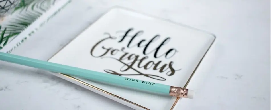 A square plate and a pencil.