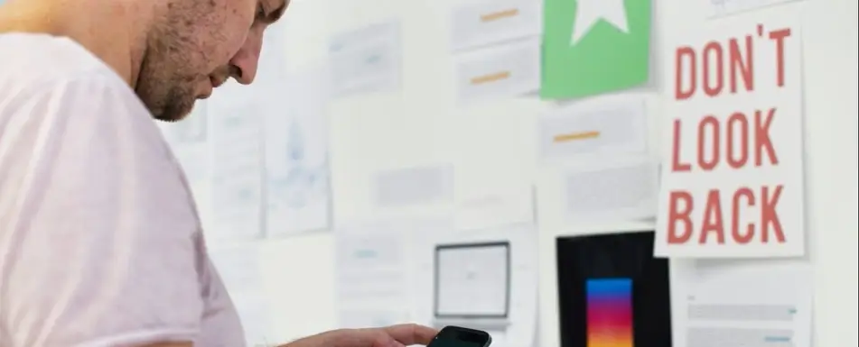 A person looking at their smartphone.