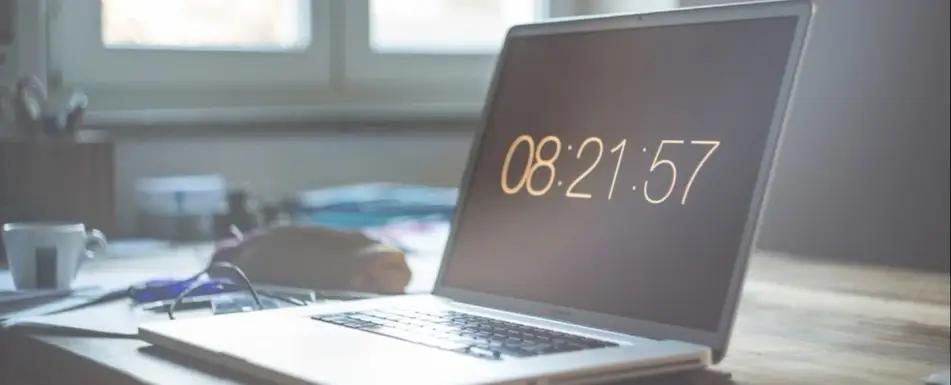 A laptop showing the time.