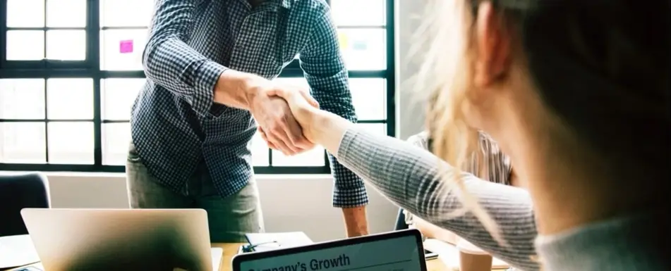 Two people shaking hands.