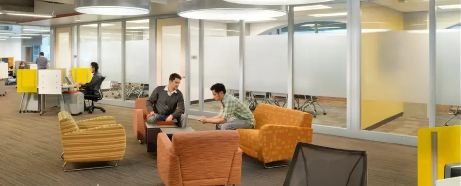A group of people in an office.