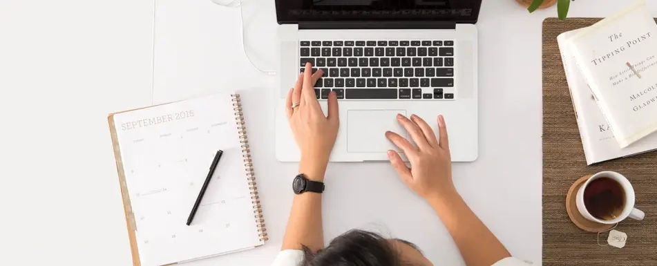 woman typing on laptop