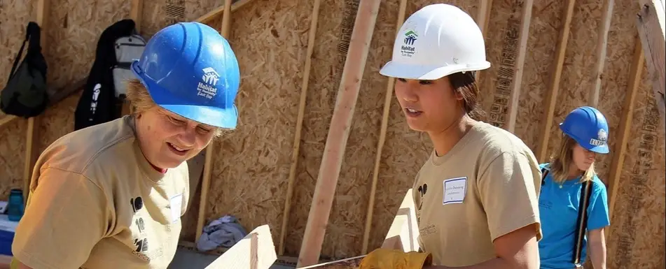 Habitat to Humanity volunteers building a house.