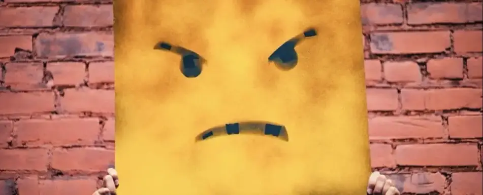 A angry face drawn on a plank of wood