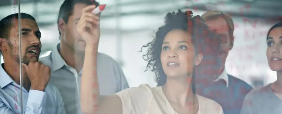 A Black woman leading a meeting.