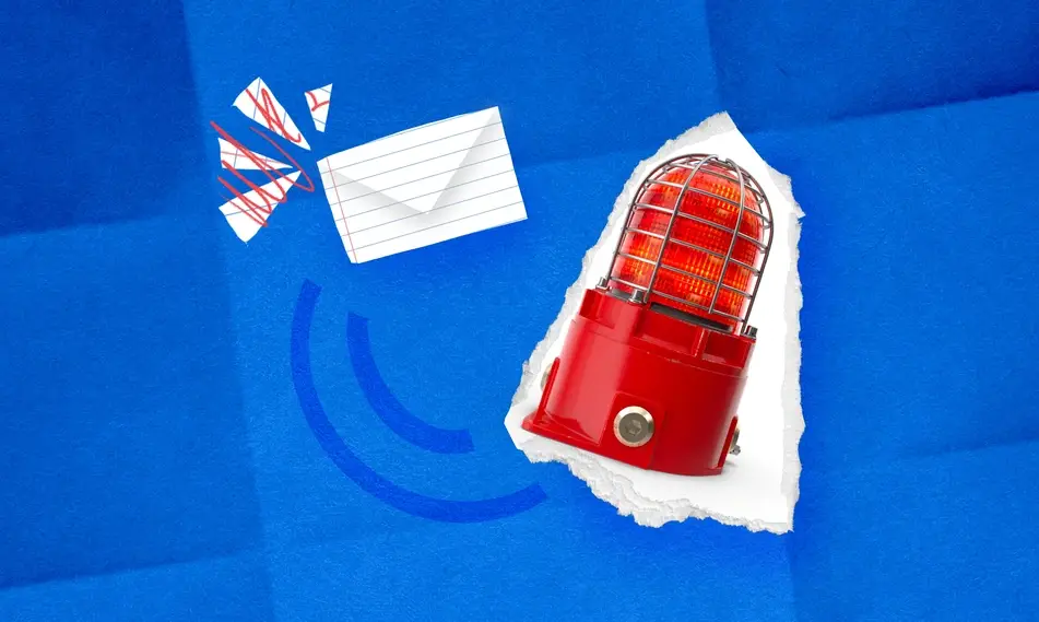 Paper collage with an envelope and an alert light