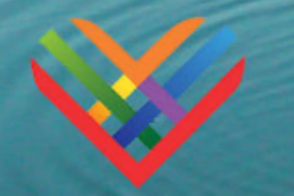 Logo de un día para dar. Un corazón de colores
