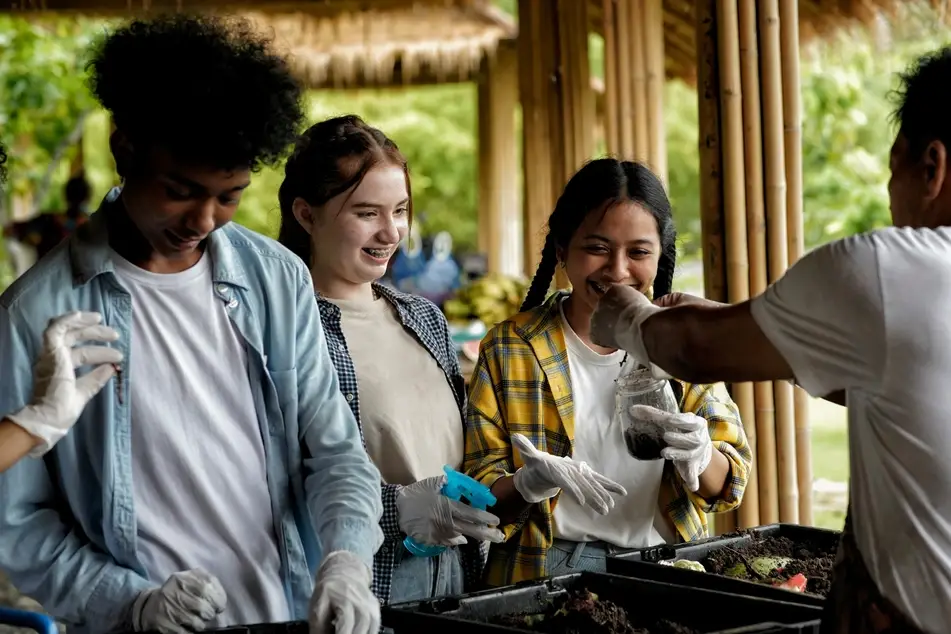 Young people from Gen Z volunteering at a farm.