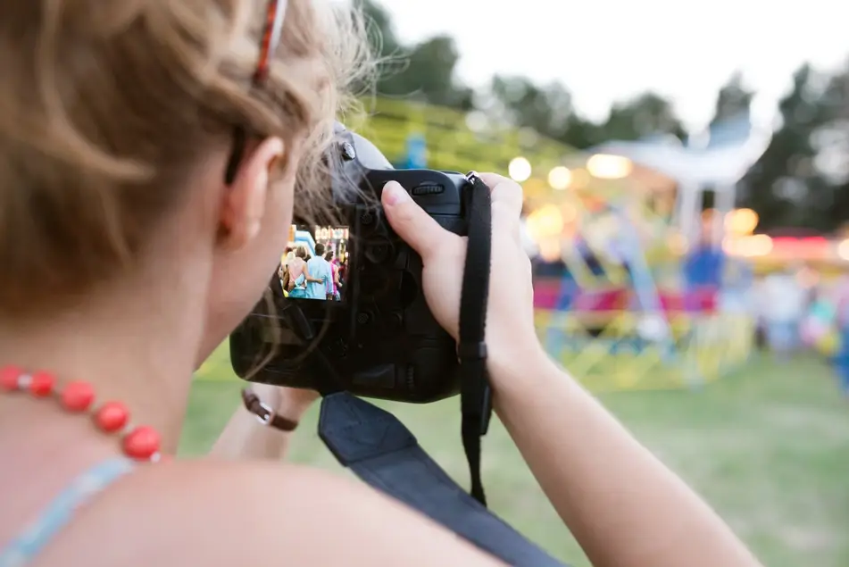 Woman photographs event gala as a volunteer