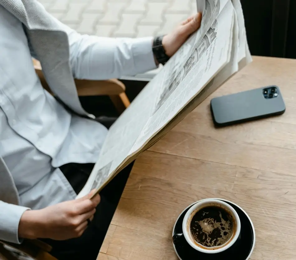 person reading a newspaper