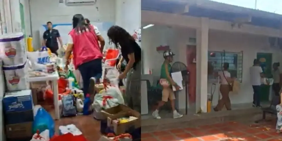 Personas entregan donaciones en un centro de acopio