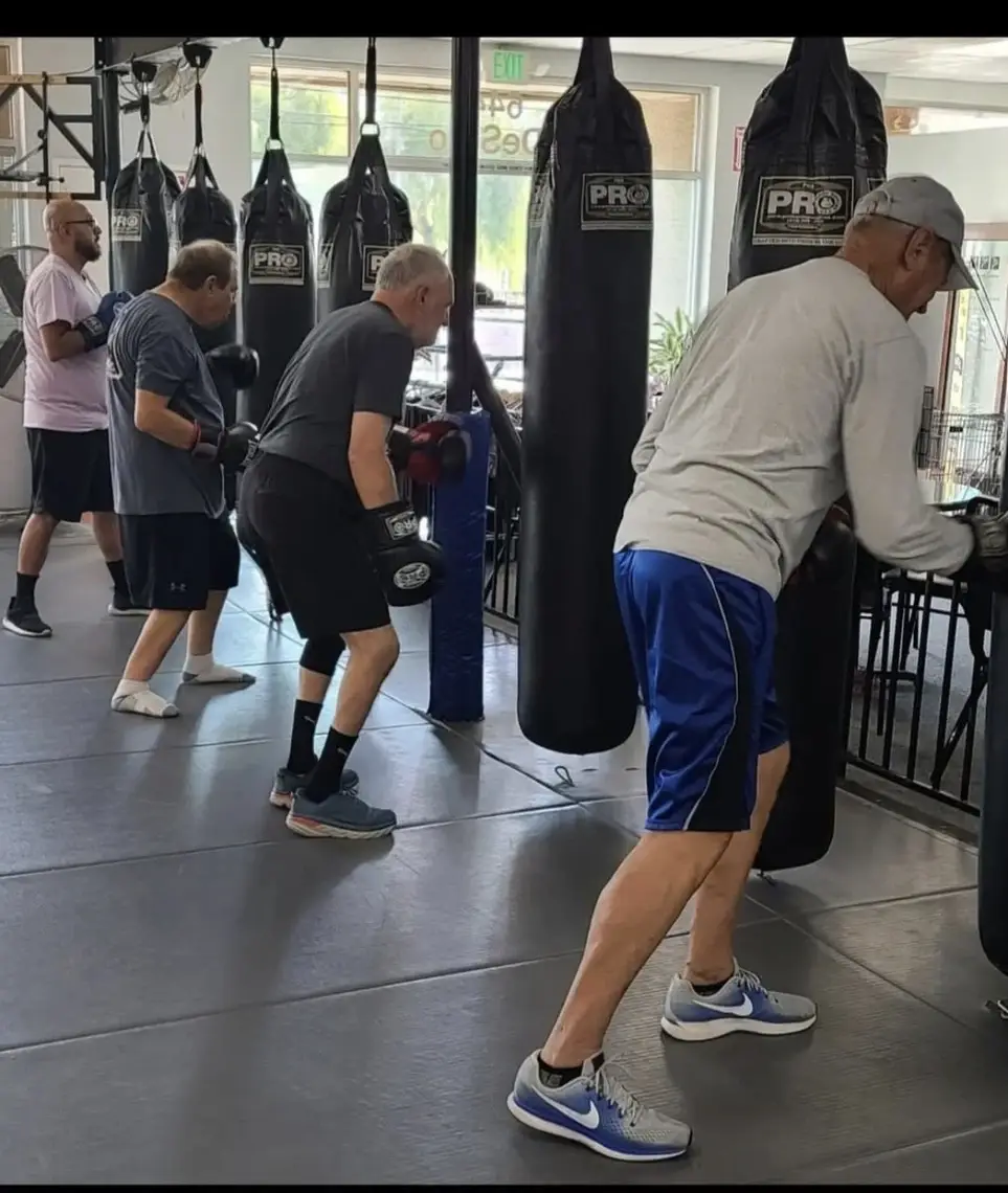 Volunteer Trainer Assistant for Neuro-Adaptive Boxing