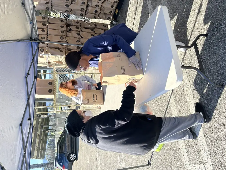 Handing out bags of food to older adults - ONE time only food pantry day