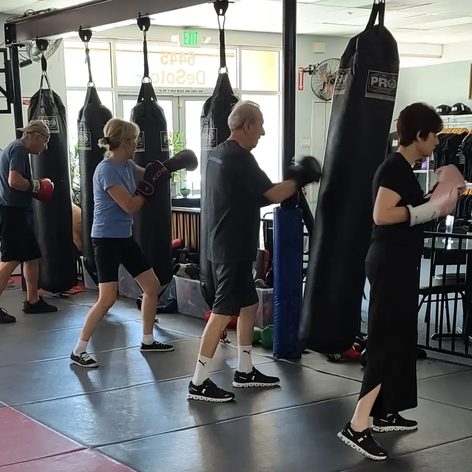 Volunteer Trainer Assistant for Neuro-Adaptive Boxing